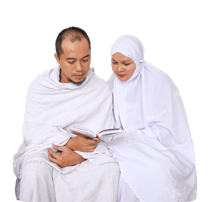 Muslim Hajj Couple In White Clothes Praying With Al Quran Together